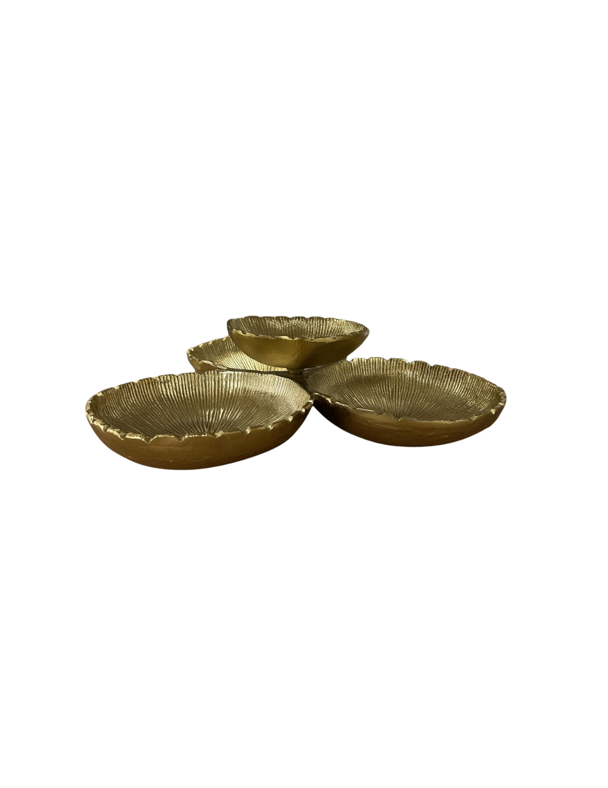 Set of four small round gold-colored bowls on a white background
